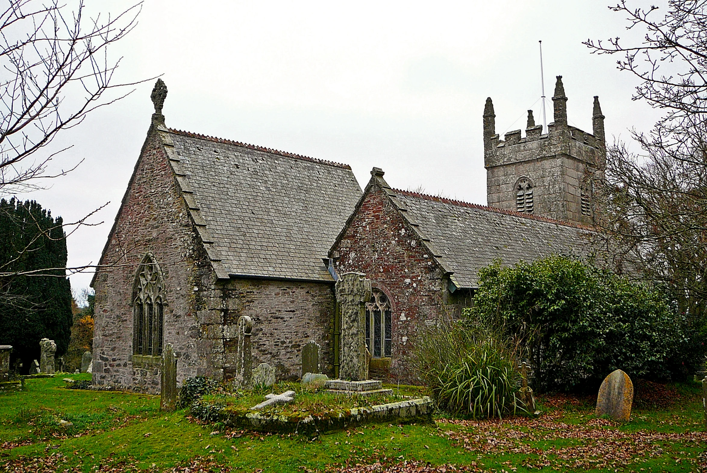 a gothic - style church with an old graveyard