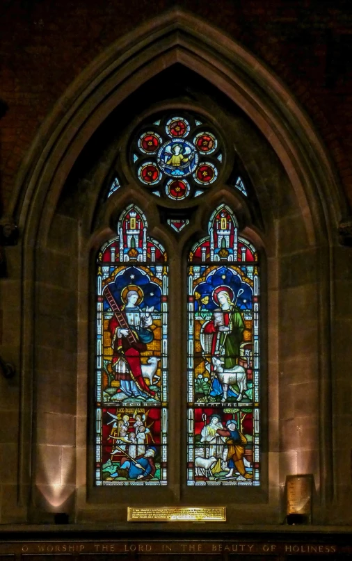 there is an ornate stained glass window inside a church