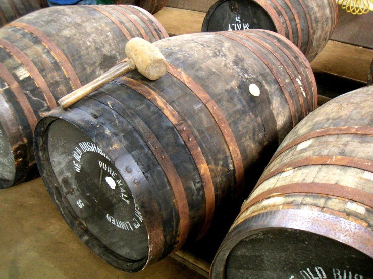 several old wood wine casks stacked on each other