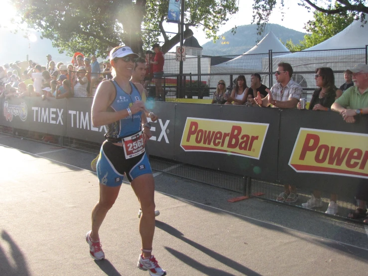 there is a woman that is running with a racket in hand