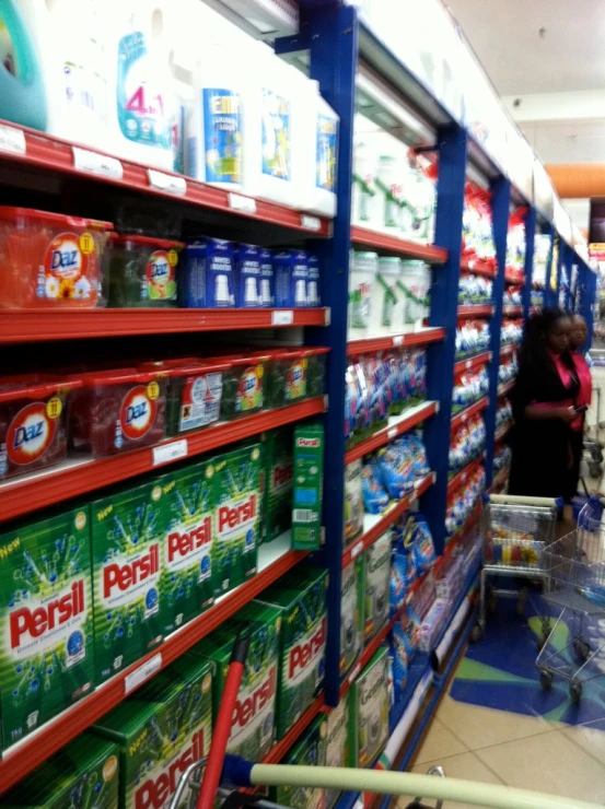 a display in a store with people shopping for products