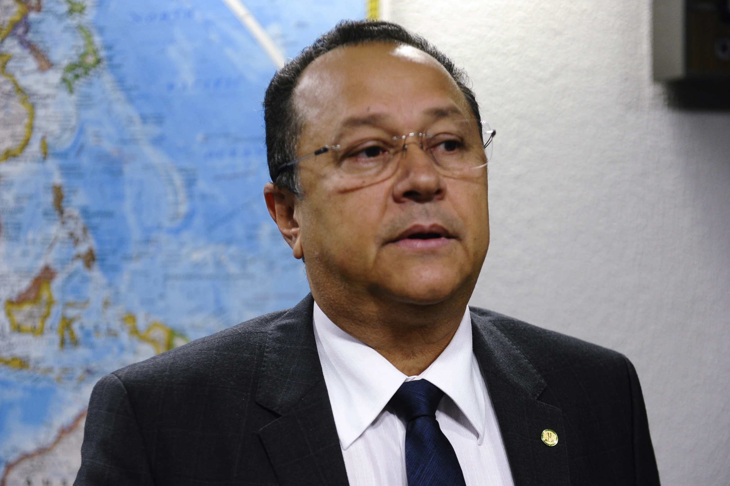 a man wearing a suit and tie looks up