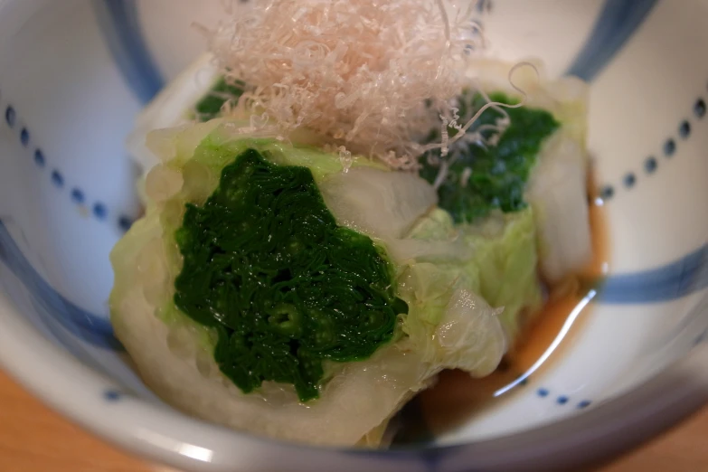 this is a small dish of food, it is made with broccoli and soing sprout