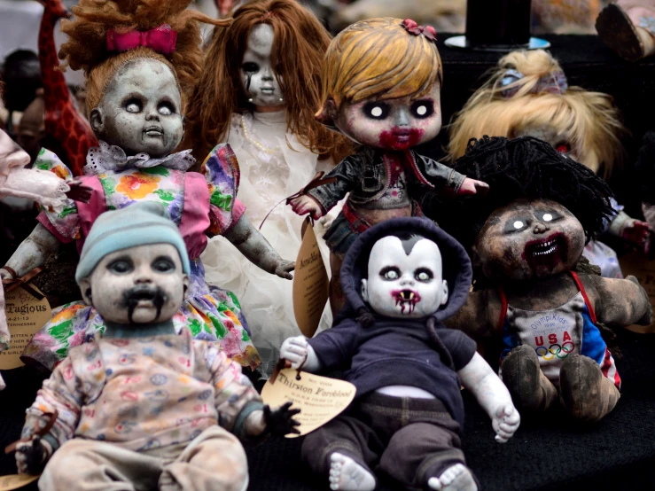 a group of creepy dolls that are sitting down