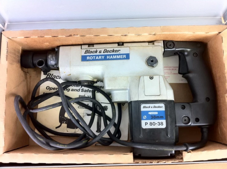 a box containing different electric tools and a cord