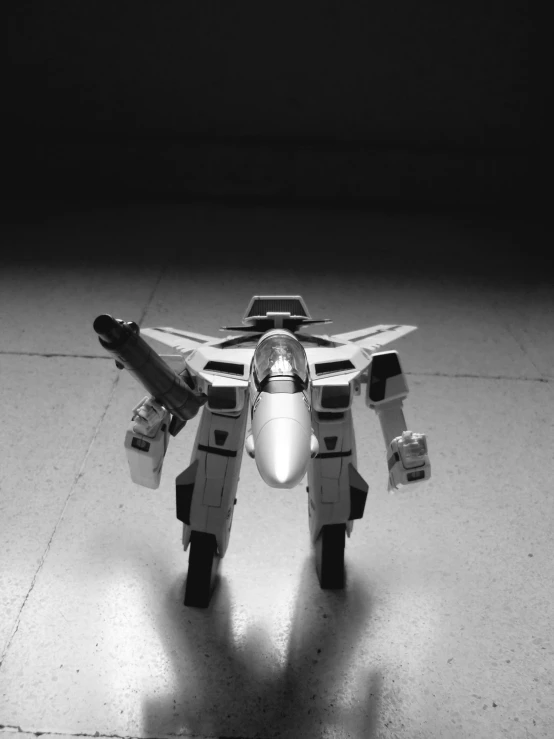 a model of a jet sitting on a tiled floor