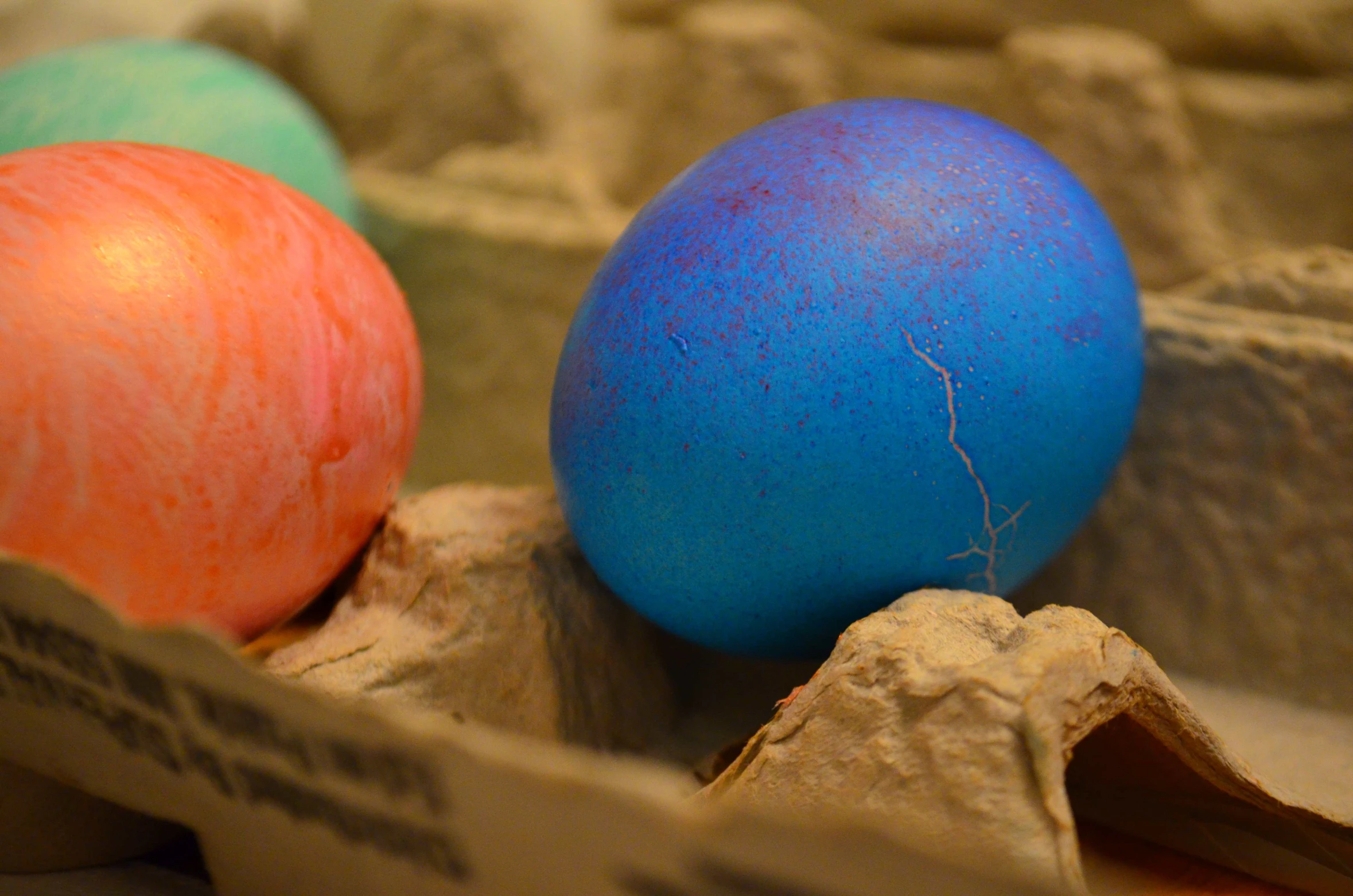 two eggs in a carton with an egg shell