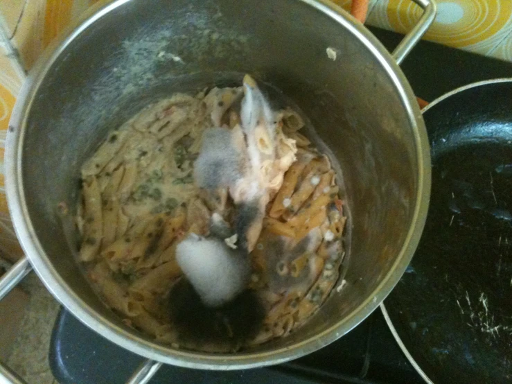 an empty pot with some food inside