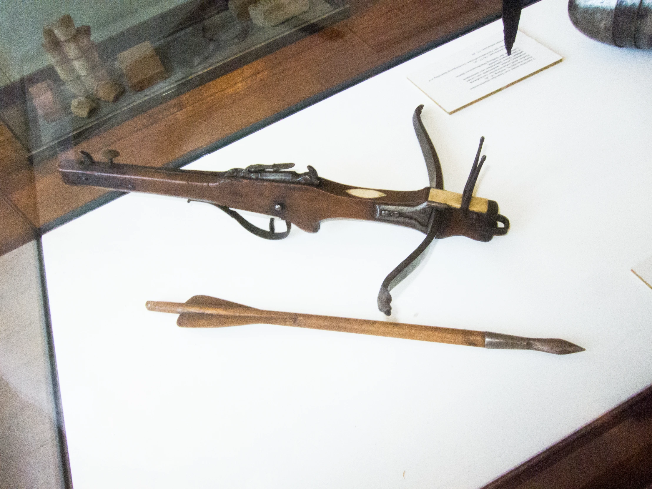 a gun and other weapons are shown on display