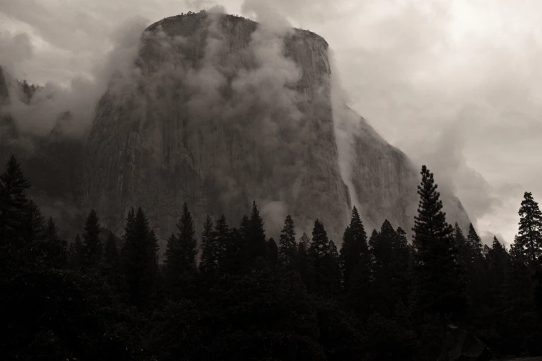 a large rock on the side of a mountain