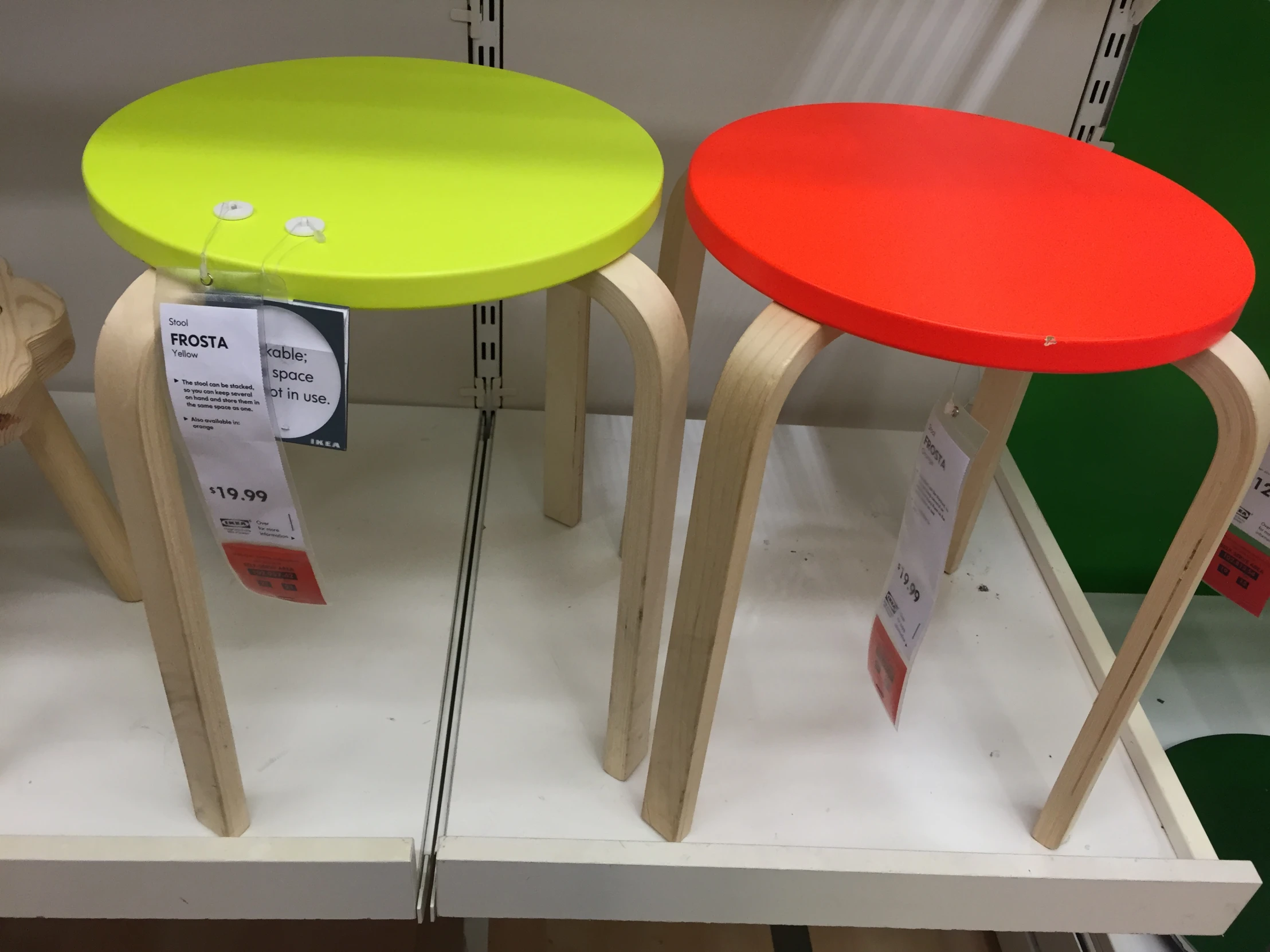 three stools on a display at a store