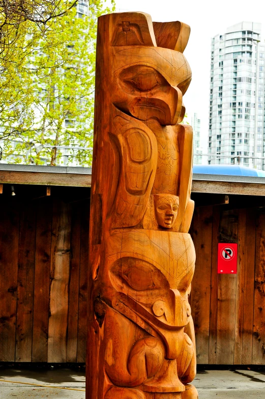 a large stone sculpture is in front of a building