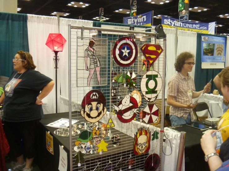 some women looking at various decorations on a display