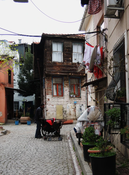 an old - fashioned town with a baby carriage