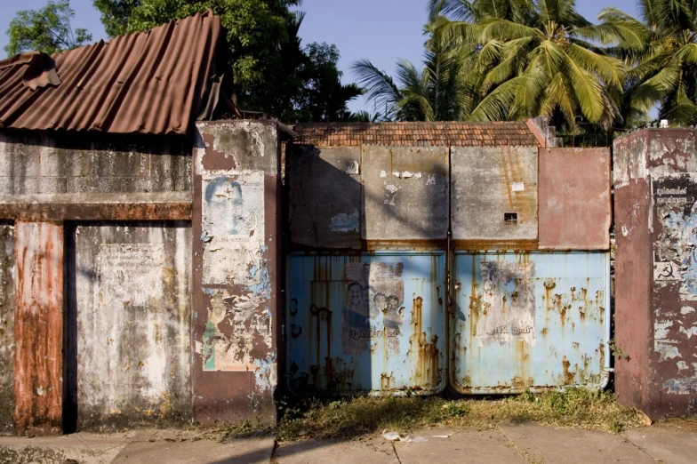 there are several rusted doors on this house