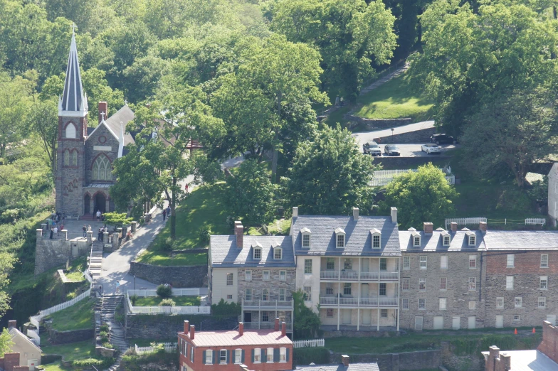 a view of a huge old mansion that is in the middle of a forested area