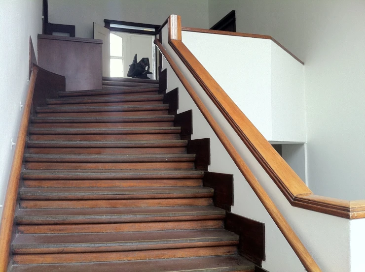 stairs in the house with man standing at the top