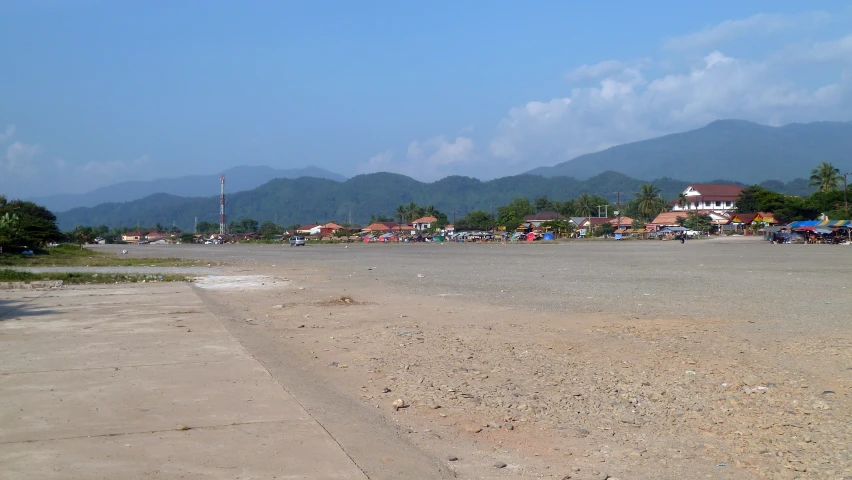 a small town surrounded by mountains and beach