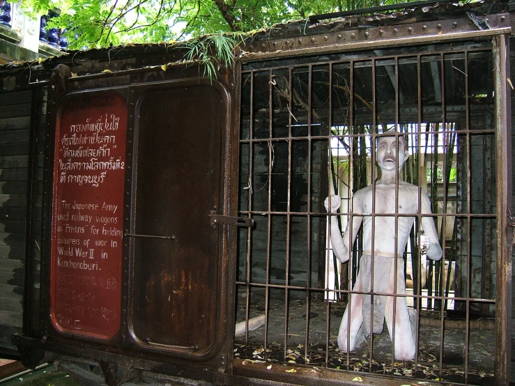 the dummy is in the cage with writing