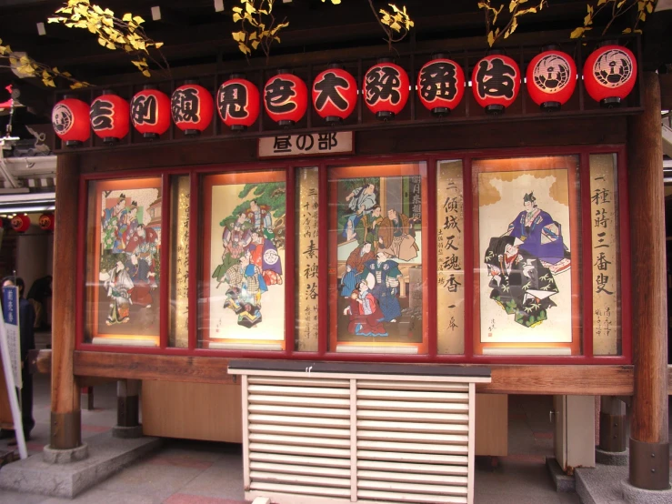 an asian style wall on display at a train station