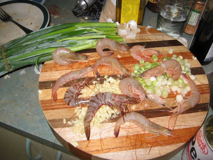 fresh seafood is on the wooden  board