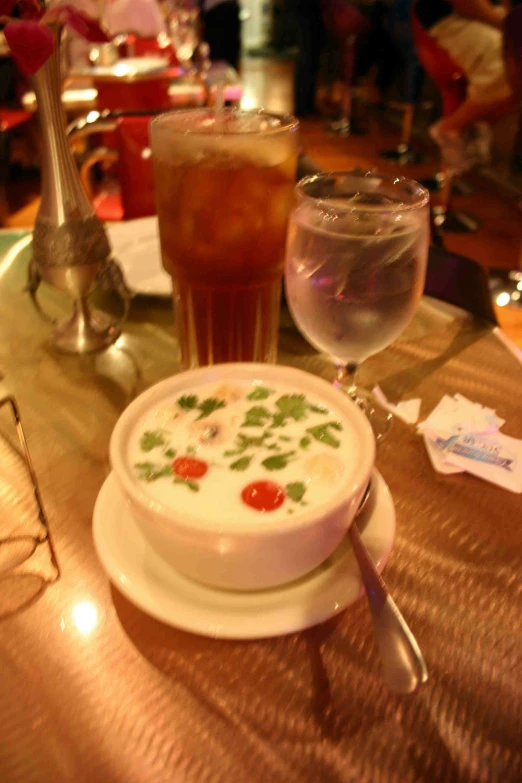 a bowl with some cream on a plate