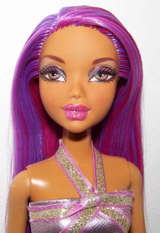 the doll has purple hair and pink makeup