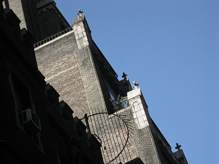 an old clock tower near a street lamp