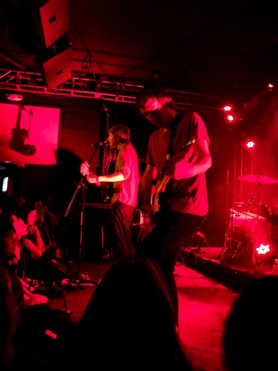 the band plays live at the nightclub while on stage