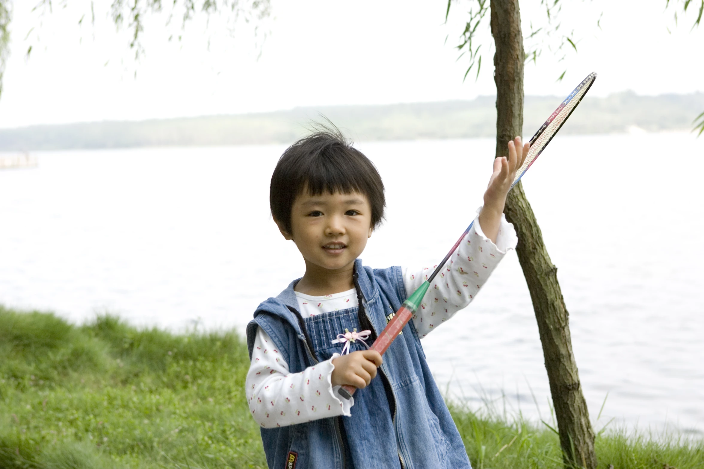 a  holding up two stick's of kite