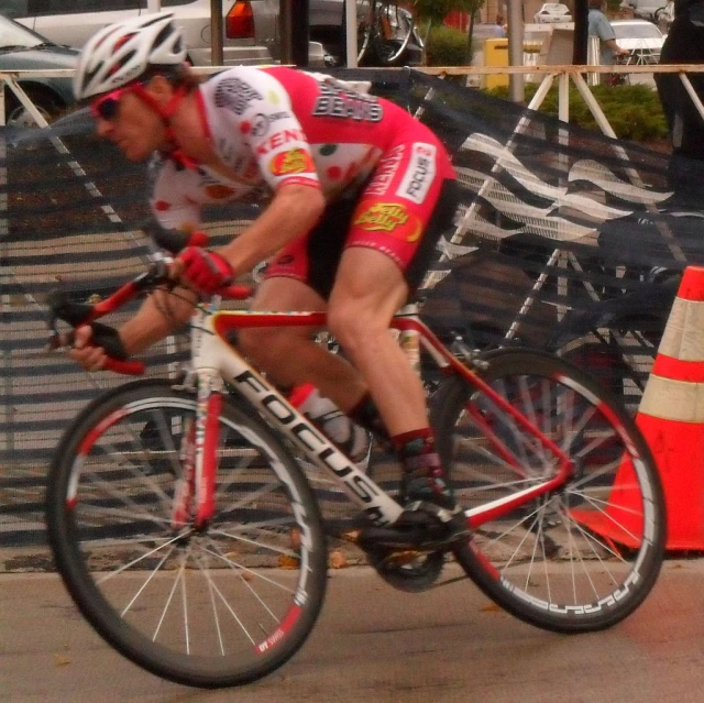 a man riding a bike on the road