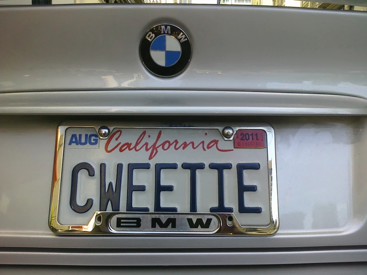 an american license plate attached to a bmw