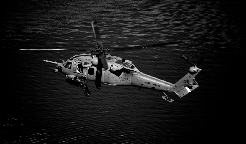 black and white po of helicopter in the air