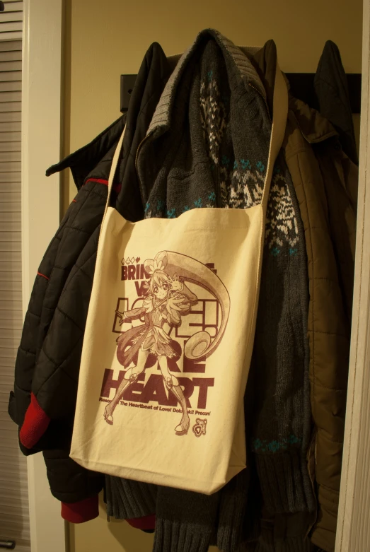 a bag sitting on top of a coat rack