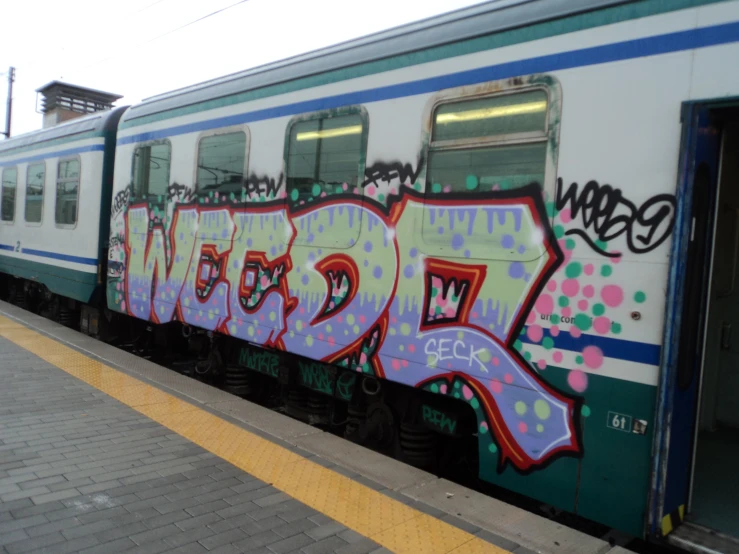 a train car with graffiti written on it