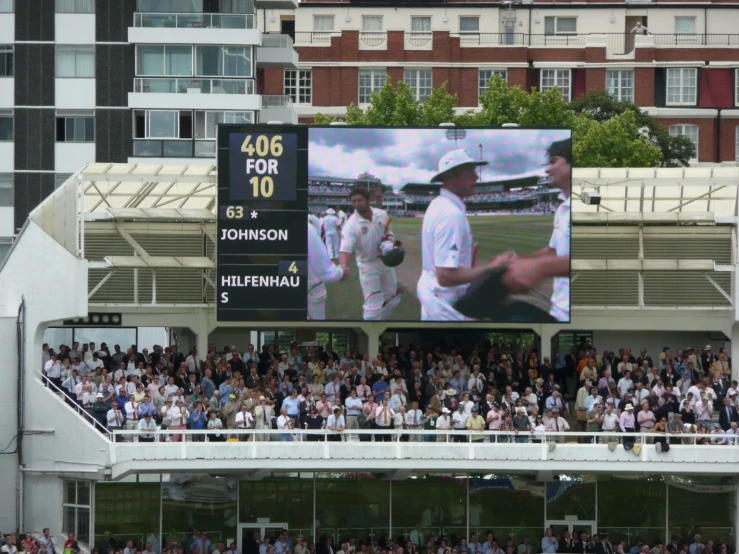 the scoreboard is displaying an image of a professional baseball player