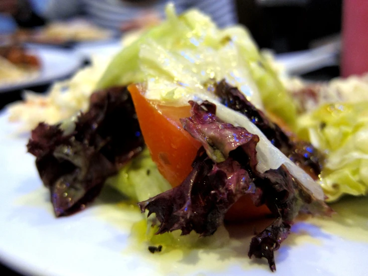 salad and salad dressing are prepared on a plate