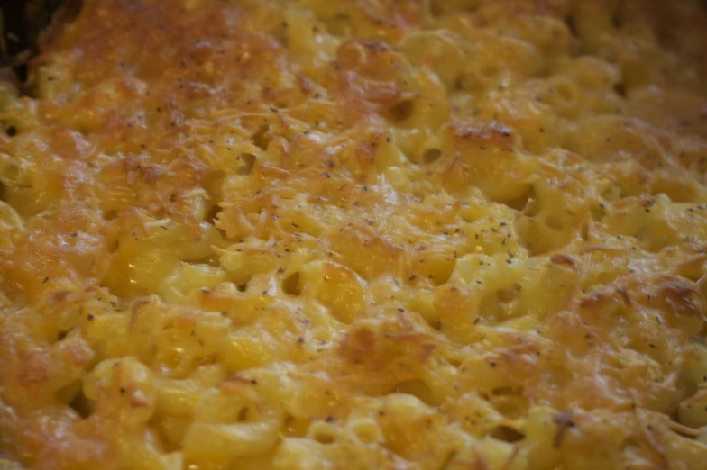 a large casserole dish is covered in cheese and sauce