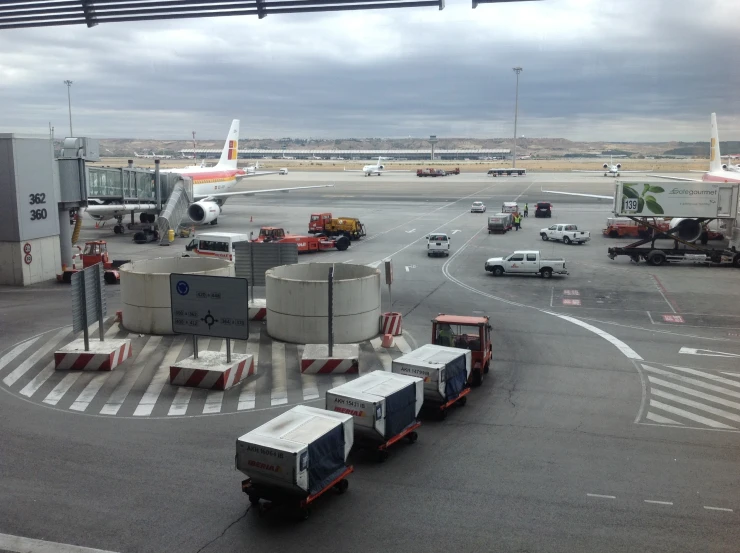 an airport with trucks driving in to it