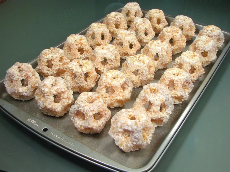 several pastries sit in a baking tray on the table