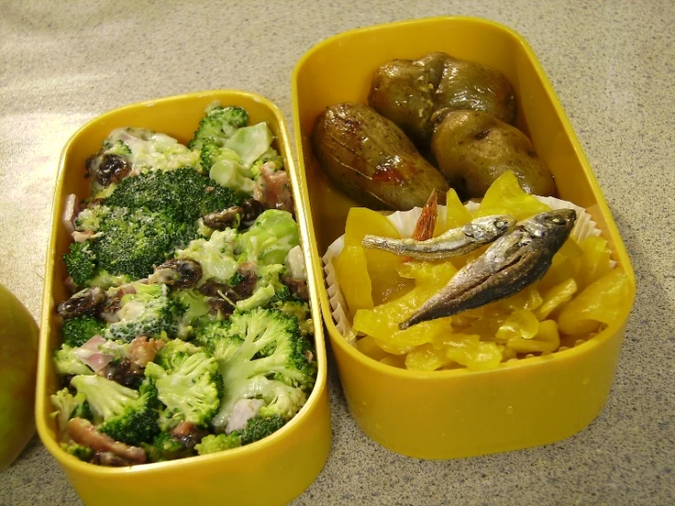 a tray of food in yellow containers