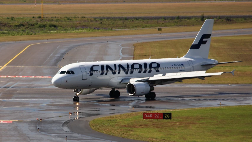 a large jet airliner sitting on top of a runway