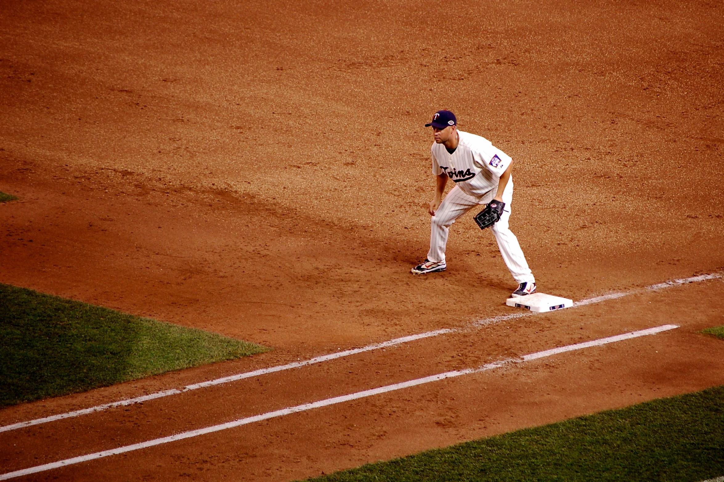 a man standing on a baseball field next to home plate