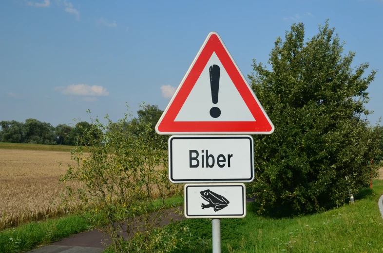 a red and white road sign with the word eiber below it