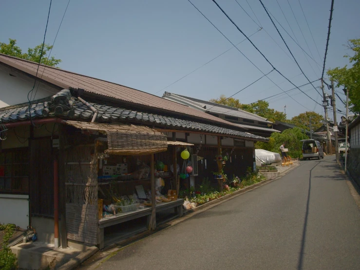 street scene of shop with electrical wires above and in front