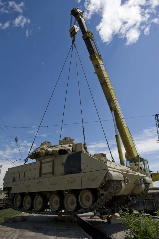 there is a crane on top of a tank