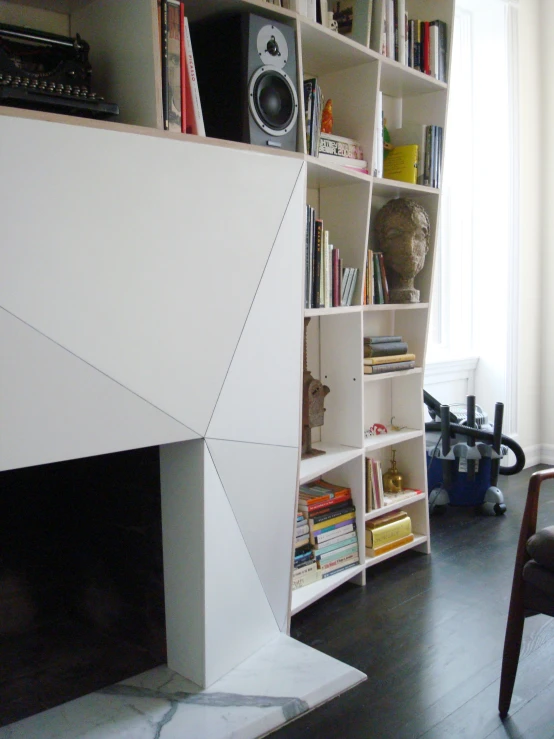 this is a nice room with a fireplace and bookshelf