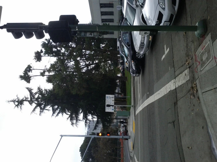 a road intersection with many cars on the street