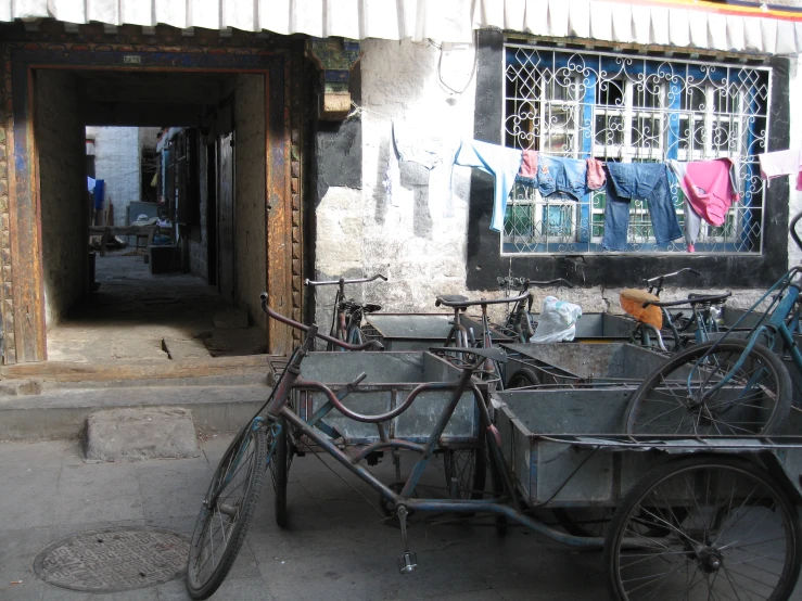 three bikes are parked in front of a building