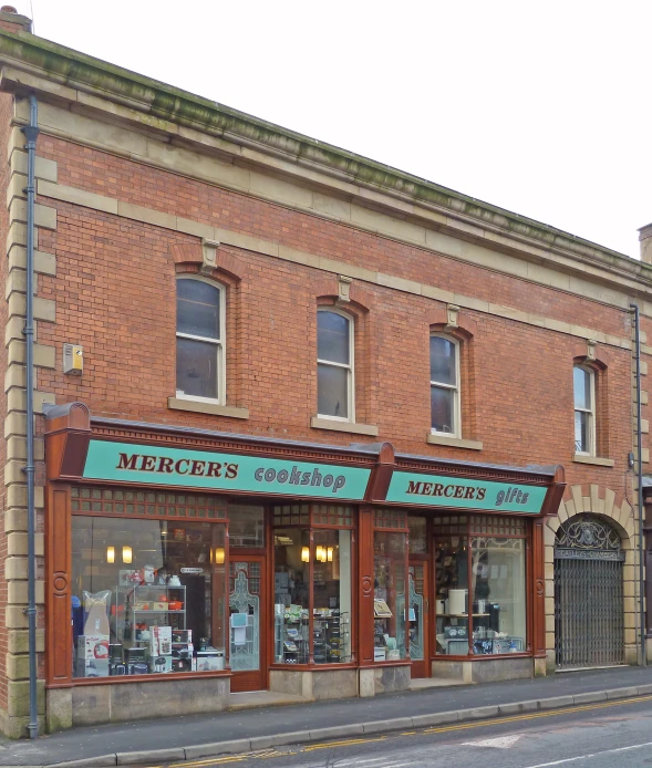 a red brick building with some shop fronts